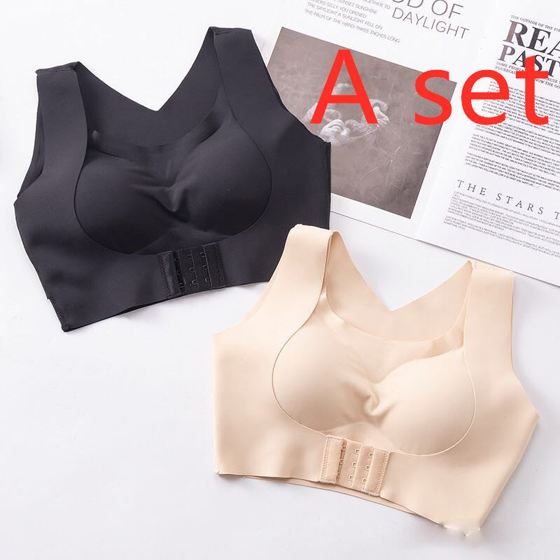 Black and beige bras on a white surface with a newspaper in the background.