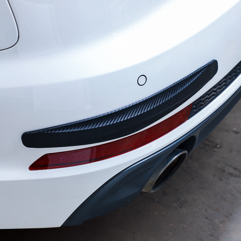 Car bumper protector strip 2-pack in carbon-fiber black installed on rear bumper.
