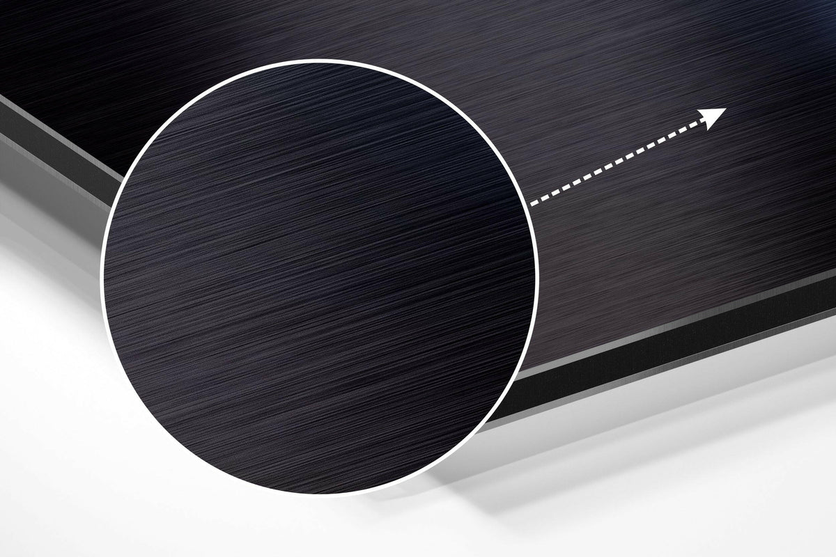 Magnified detail of the brushed metal grain showing through the neon outline floating astronaut print
