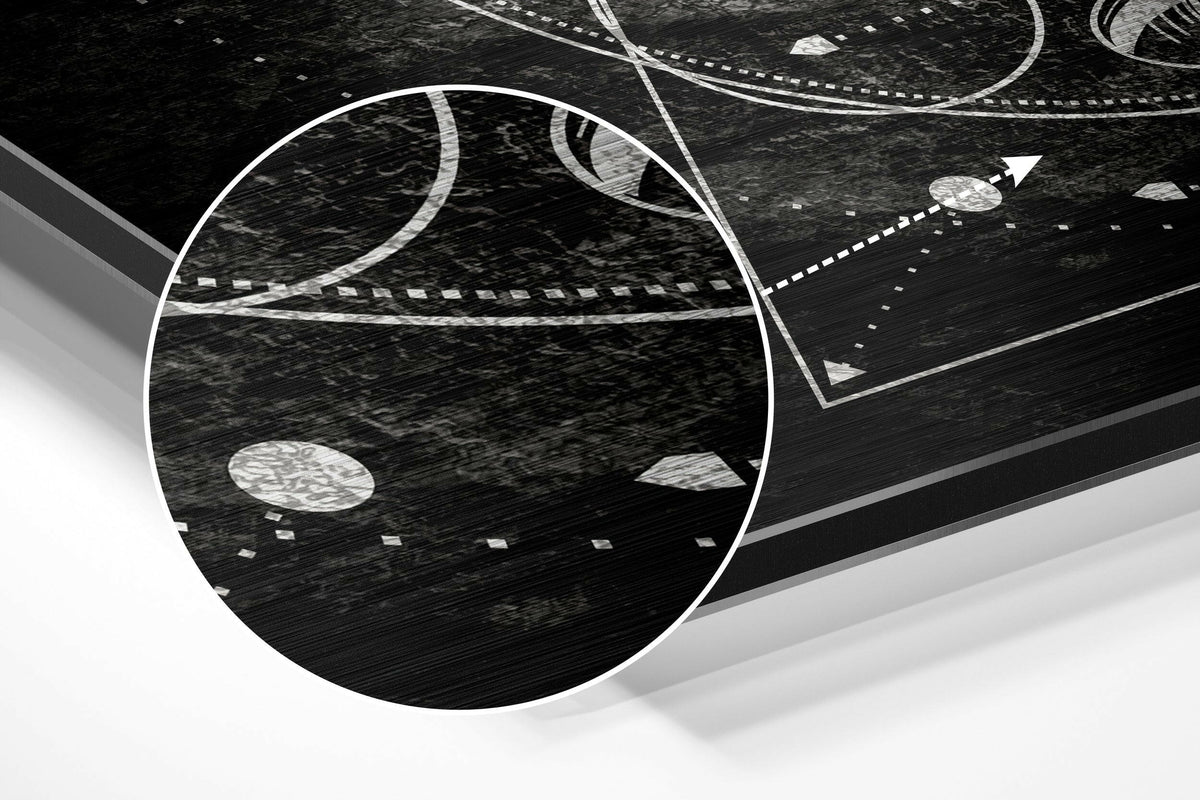 Magnified detail of the brushed metal grain showing through the sacred geometry pyramid and eye print