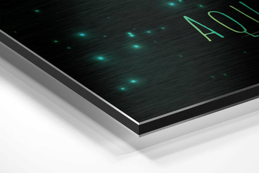Aquarius zodiac sign in green brushstrokes brushed aluminum panel corner close-up showing the brushed metal grain