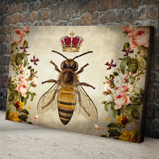 Crowned Queen Bee with Roses canvas leaning against a wall, shown at an angle