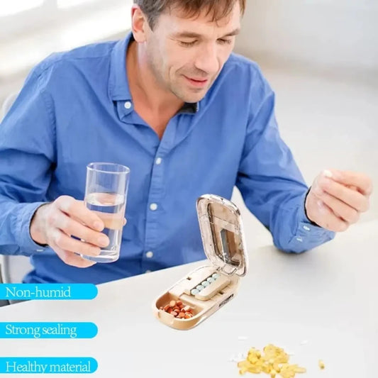 Adjustable pill cutter cutting round pills with sharp blade visible through clear lid