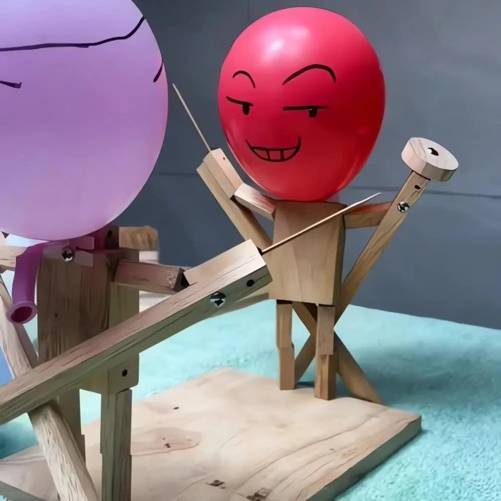 Balloon battle game desk toy with articulated wooden fighter puppets