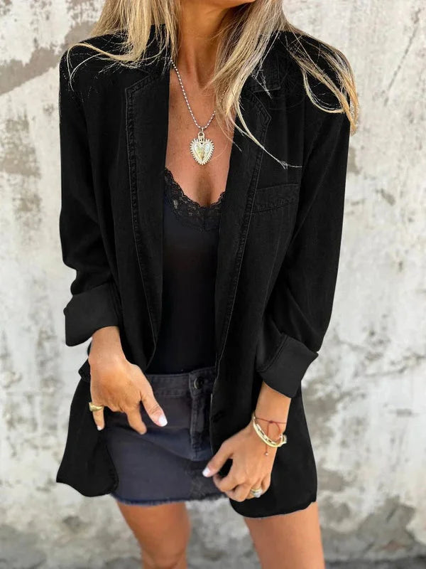 Black denim lapel shirt jacket paired with a lace camisole and skirt for a sleek outfit