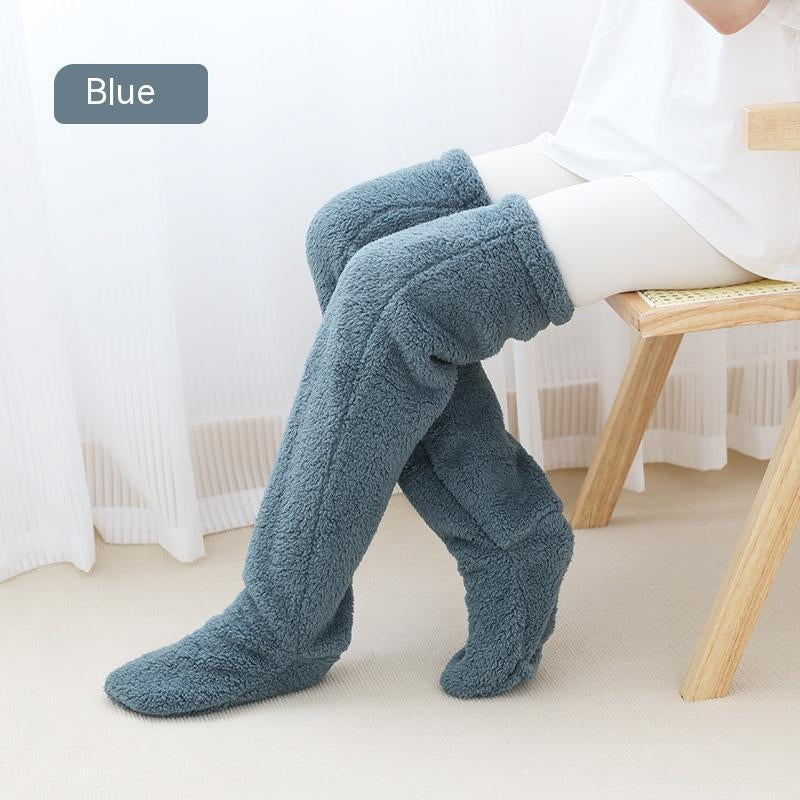 Blue fuzzy over knee socks worn indoors for winter warmth