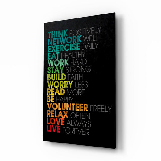 Stacked advice words in teal, green, yellow, orange and red over gray words on black, glass wall art