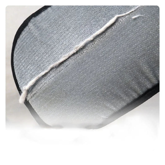Close-up of grey electrostatic fabric on pet hair removal glove lifting embedded pet fur.