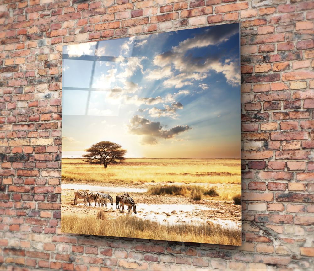 African savanna acacia and zebras glass wall art on a red brick wall