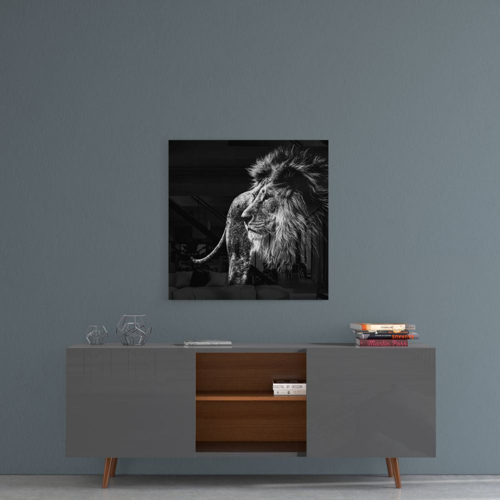 Black and white lion profile glass wall art on a blue-gray wall above a gray sideboard with wood shelves