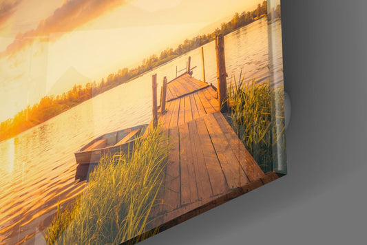 Glossy edge close-up of the golden lake dock glass wall art showing reeds and planks