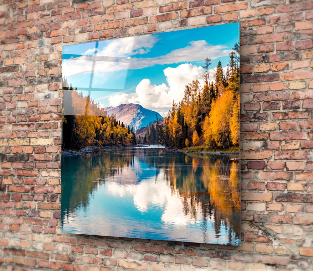 Golden autumn forest turquoise river glass wall art on a red brick wall