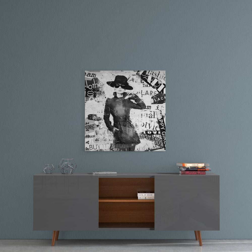 Fashion woman collage glass wall art on a blue-gray wall above a dark sideboard with wood shelves