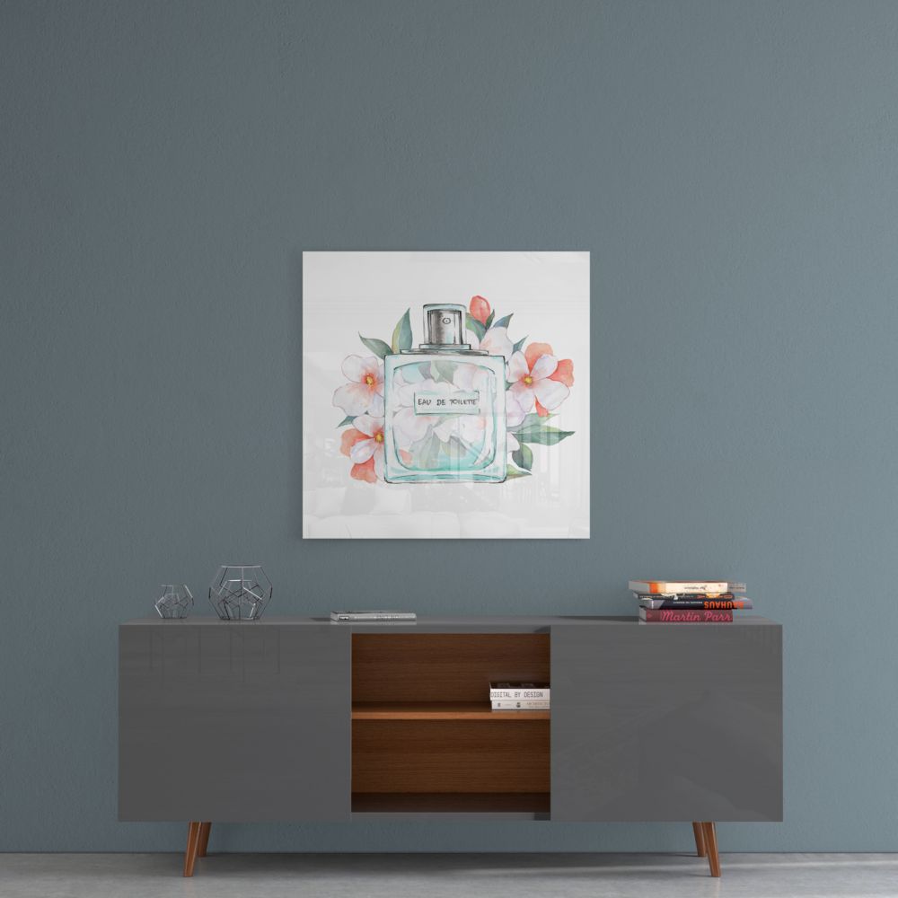 Perfume bottle and blossoms glass wall art above a gray sideboard with a wood shelf on a blue-gray wall