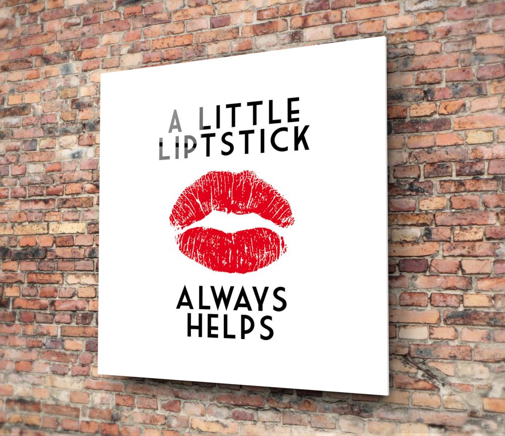 Red lipstick kiss typography glass wall art hanging on a red brick wall
