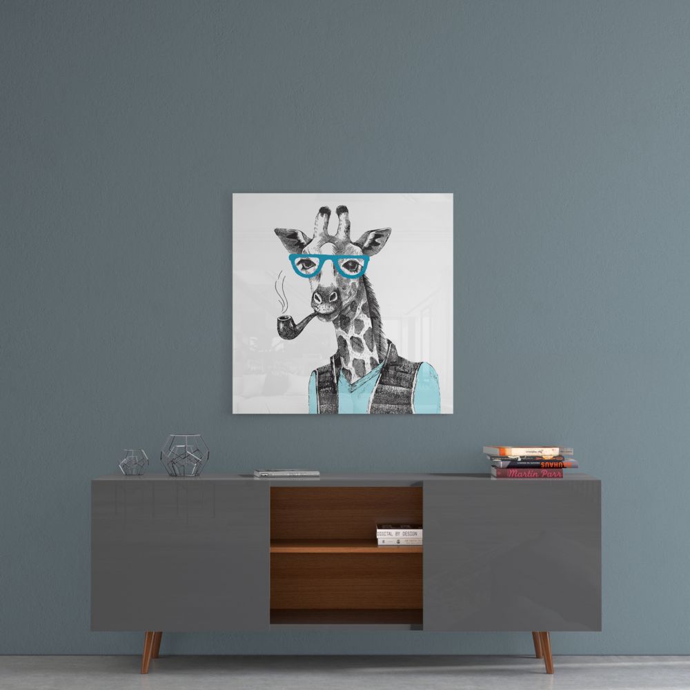 Giraffe with pipe sketch glass wall art on a blue-gray wall above a gray sideboard with wood shelves