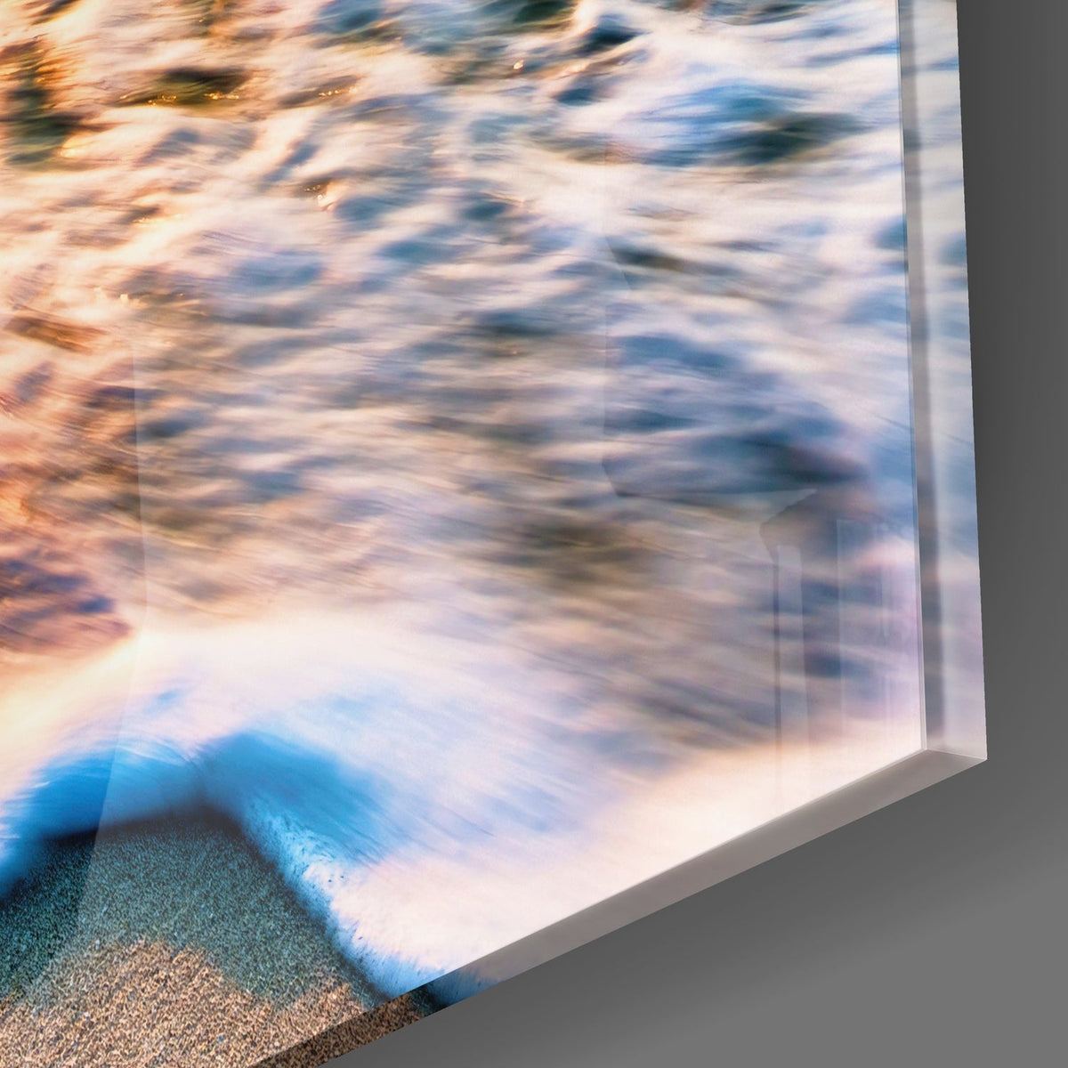 Close-up of the glossy tempered glass edge on the ocean wave sunset glass wall art