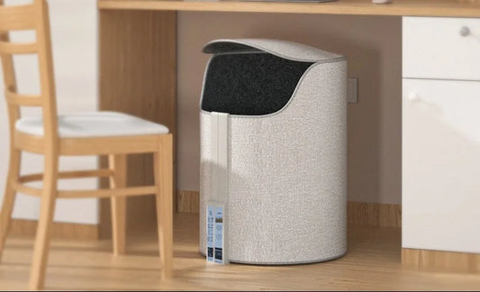 Portable foot warmer under desk in home office setting - compact winter heating solution