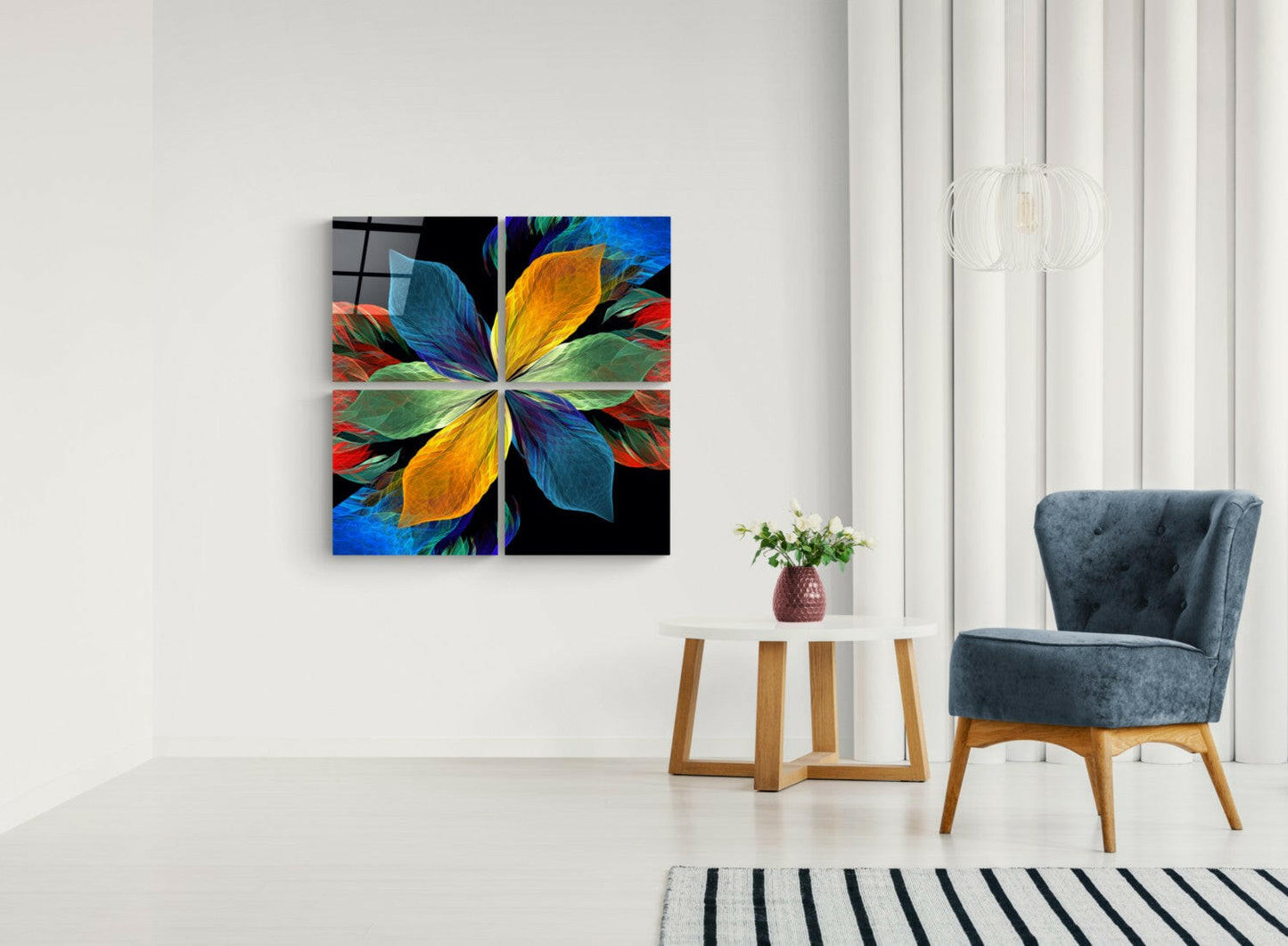 Rainbow petal four-panel glass set on a white wall beside a blue armchair and a round wood side table