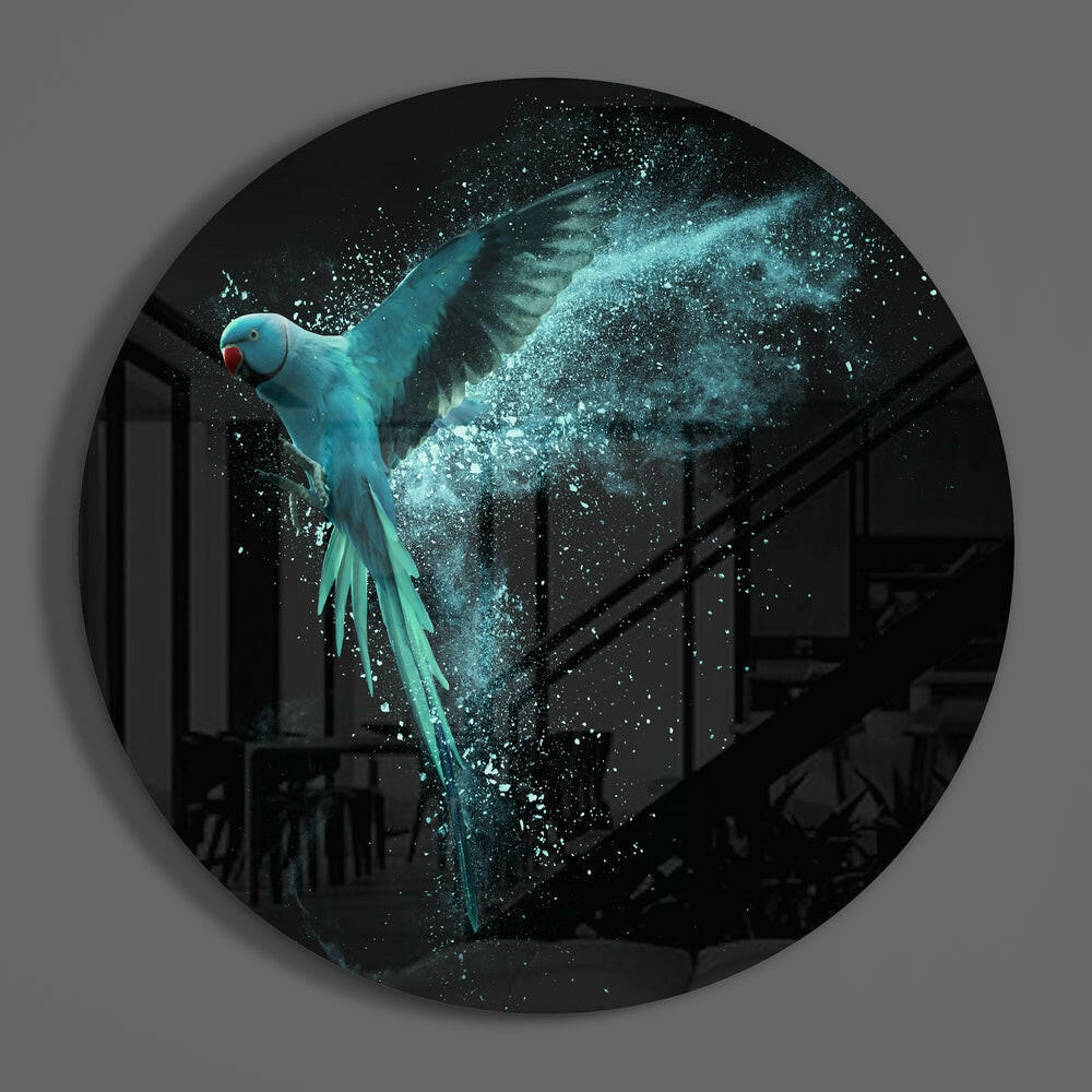 Turquoise parrot in flight round glass wall art hanging on a plain gray wall
