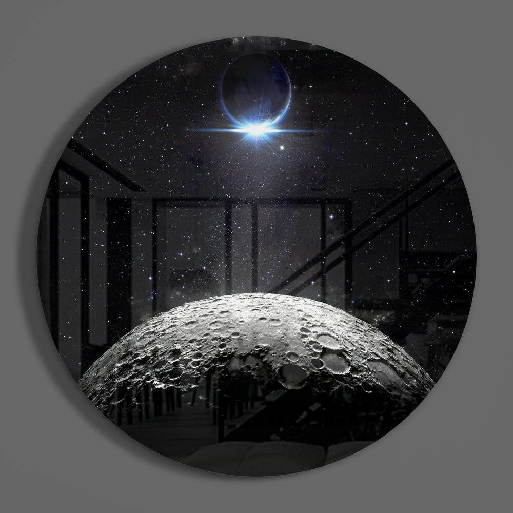 Cratered moon eclipse round glass wall art on a plain gray wall, glossy glass disc seen from the front