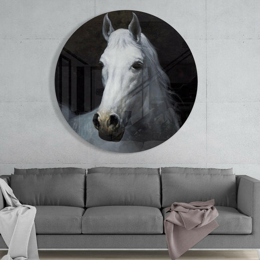 White horse portrait round glass wall art above a gray sofa with white and pink throws