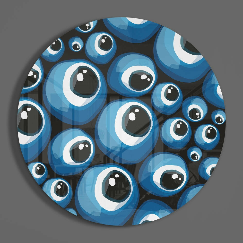 Blue evil eye pattern round glass wall art on a plain gray wall