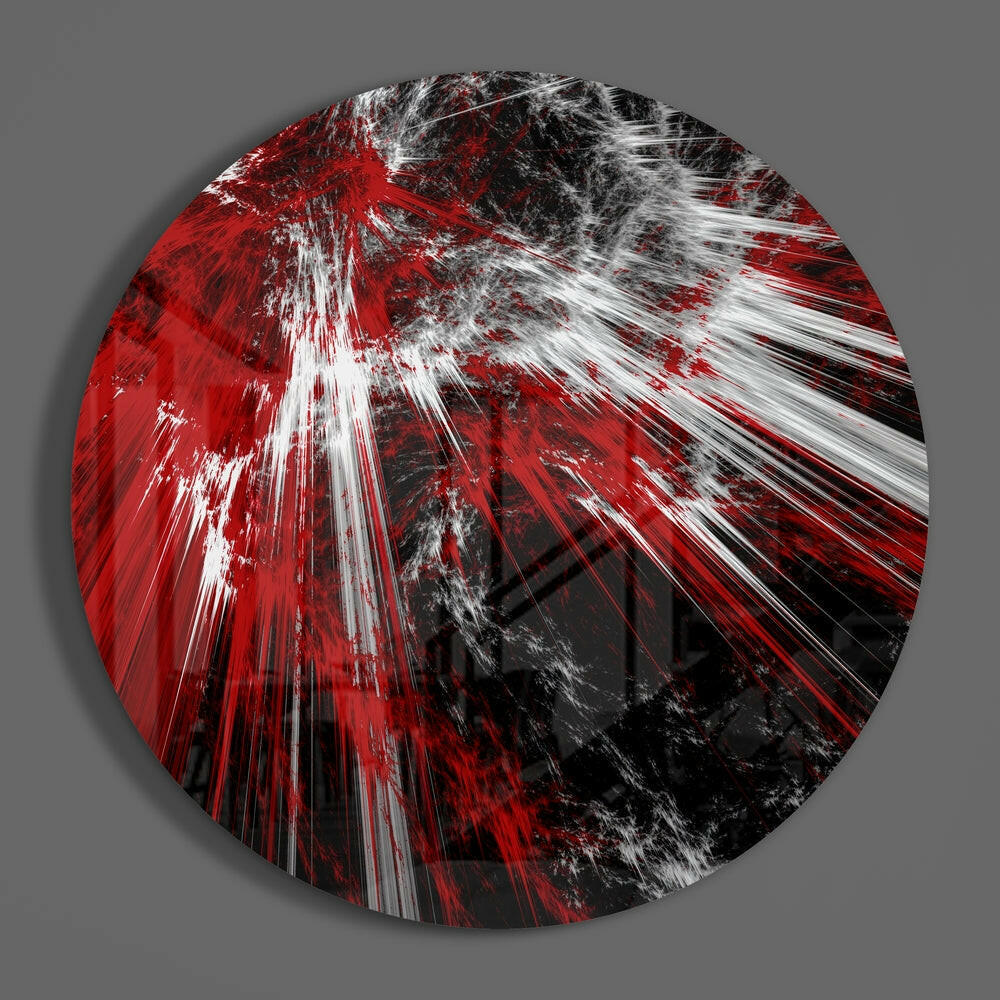 Red shatter burst abstract round glass piece shown on a plain gray wall