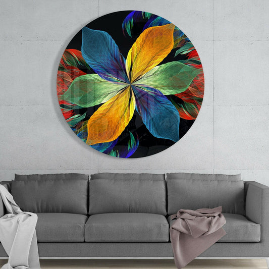 Rainbow petal flower round glass wall art above a gray sofa with white and pink throws