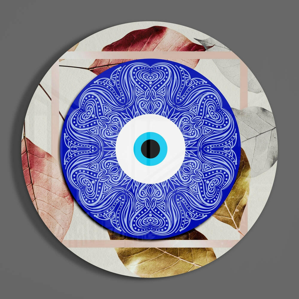 Evil eye mandala round glass wall art hanging on a plain gray wall