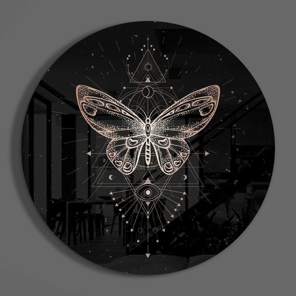 Rose gold butterfly round glass disc casting a soft shadow on a gray wall