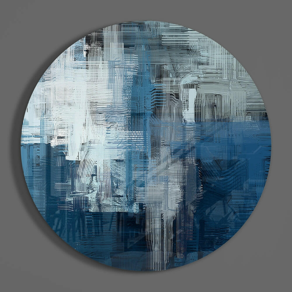 Blue and white brushstrokes round glass wall art on a plain gray wall