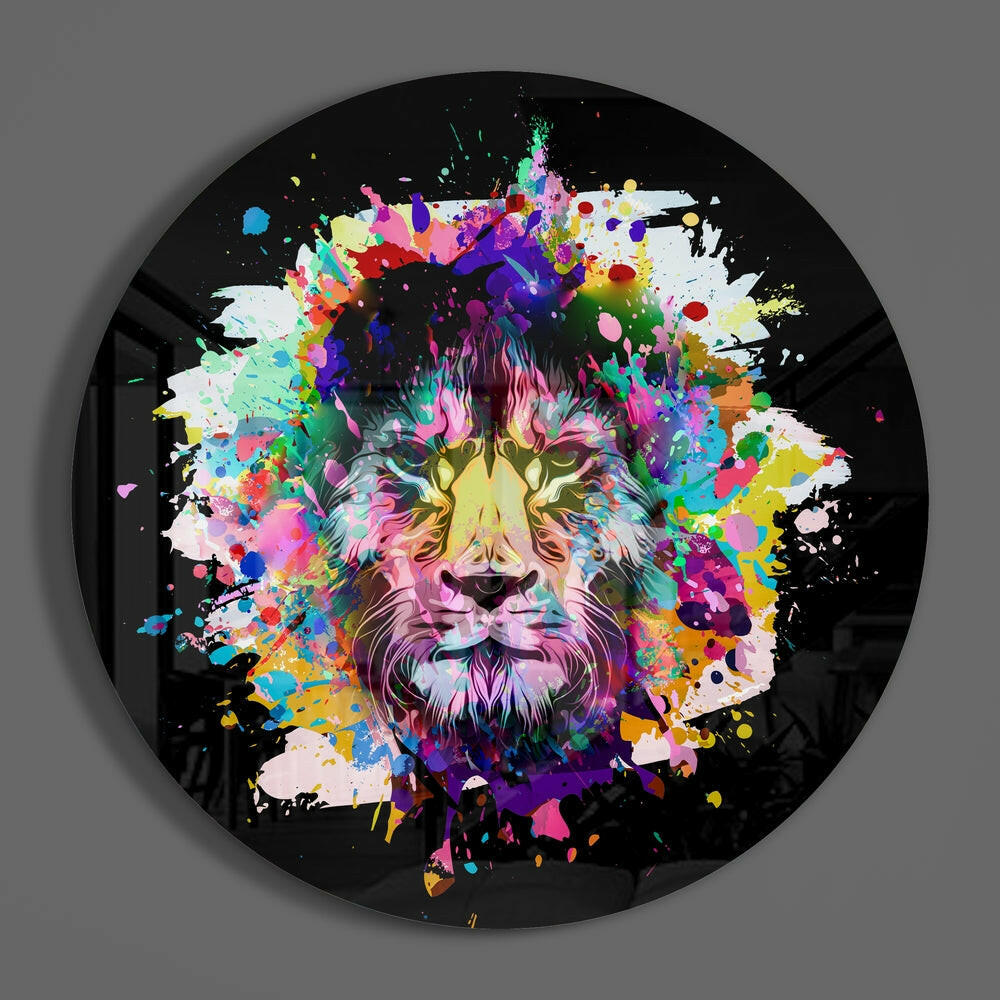 Paint splash lion round glass wall art on a plain gray wall, glossy glass disc seen from the front