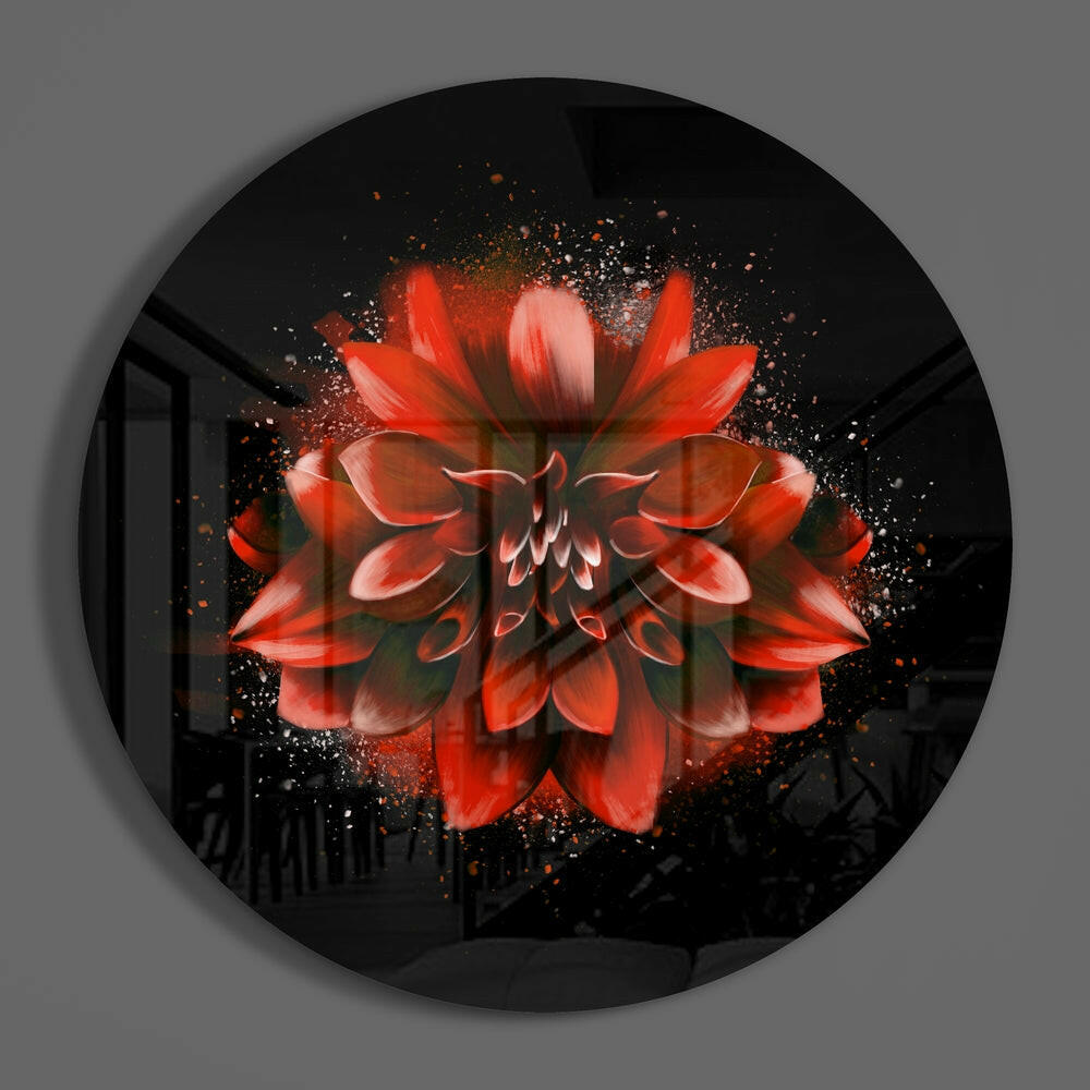 Red dahlia on black circle of glass on a plain gray wall
