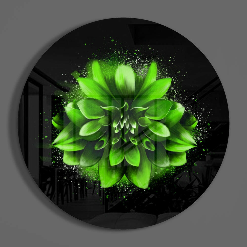 Green splatter dahlia round glass disc casting a soft shadow on a gray wall
