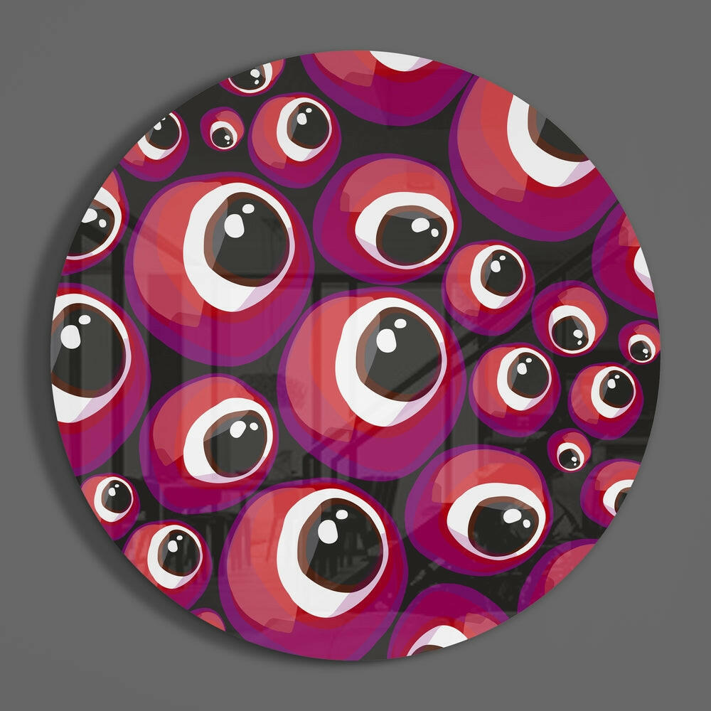 Pink cartoon eyeball circle of glass on a plain gray wall