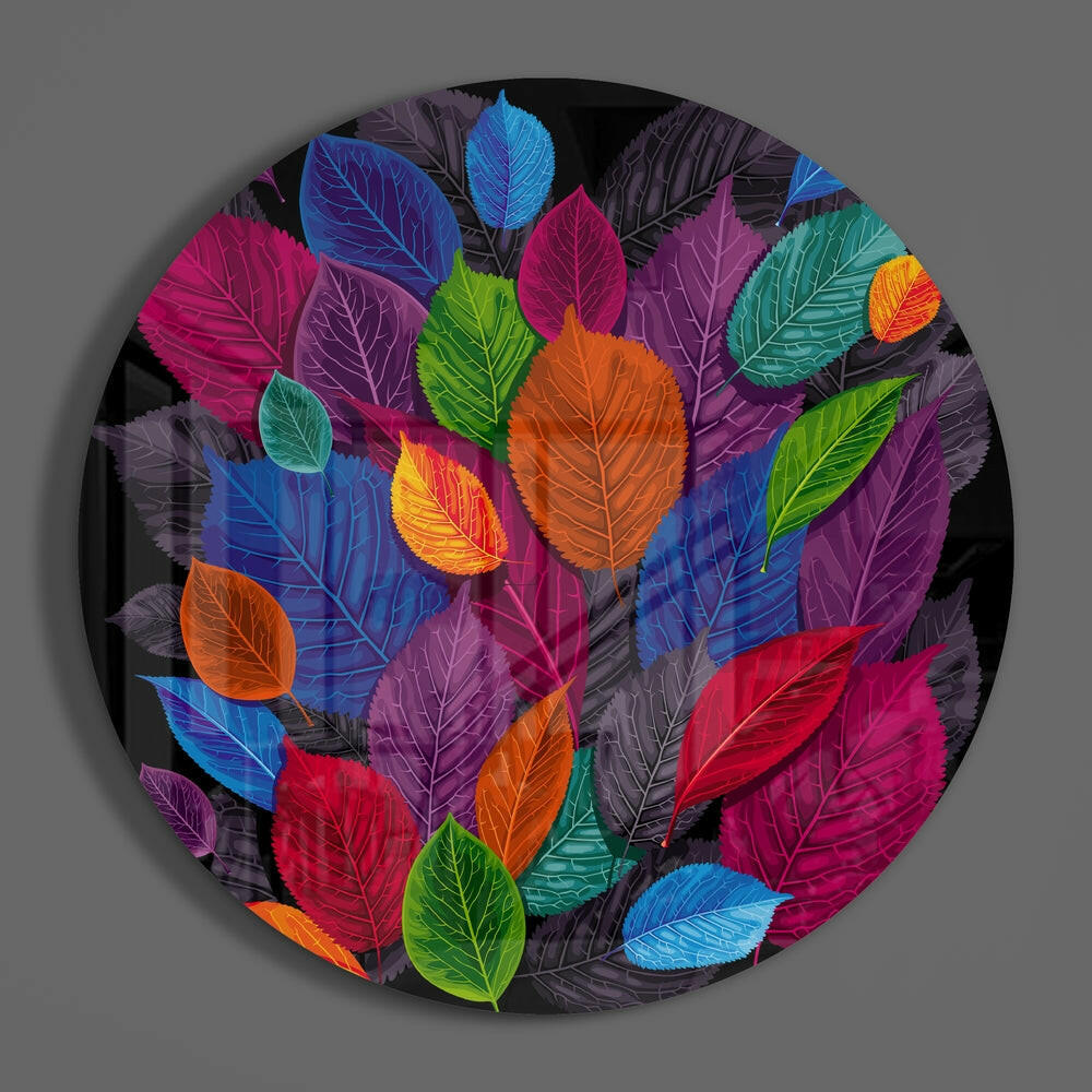 Colorful leaf cluster round glass piece shown on a plain gray wall
