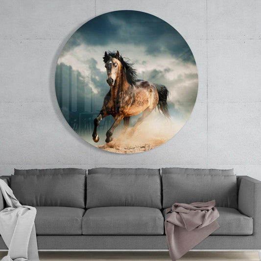 Galloping horse round glass wall art above a gray sofa with white and pink throws