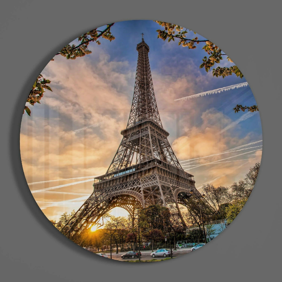 Paris Eiffel Tower round glass piece shown on a plain gray wall