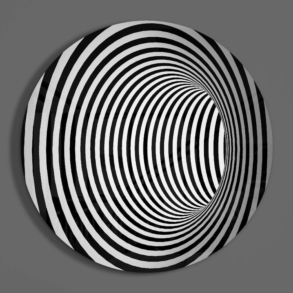 Spiral tunnel illusion round glass wall art on a plain gray wall, glossy glass disc seen from the front