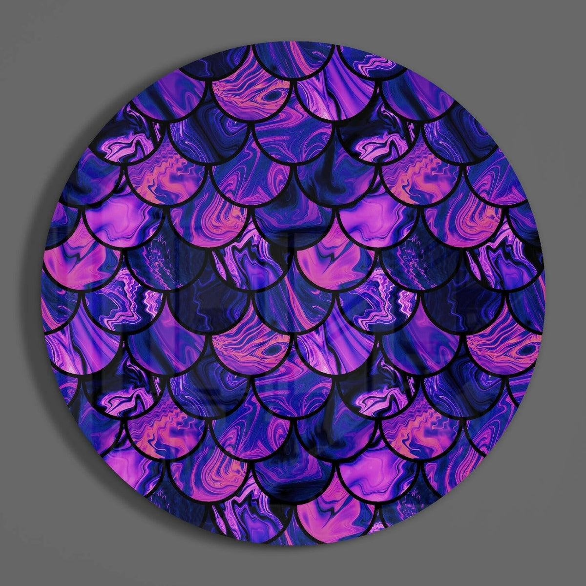 Purple mermaid scale circle of glass on a plain gray wall