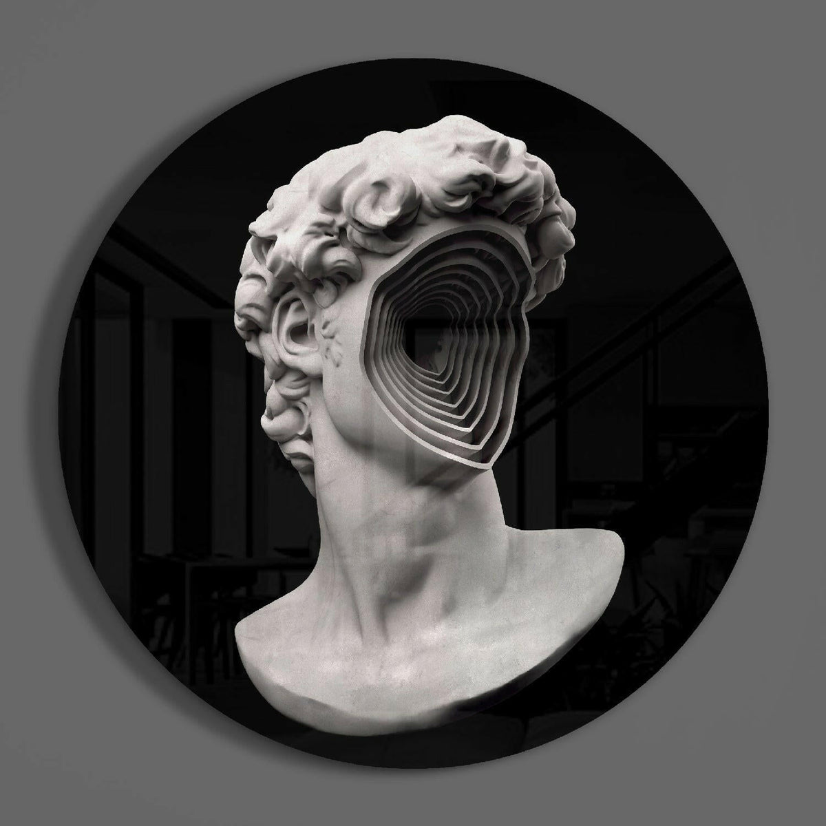 Spiral face bust round glass wall art on a plain gray wall