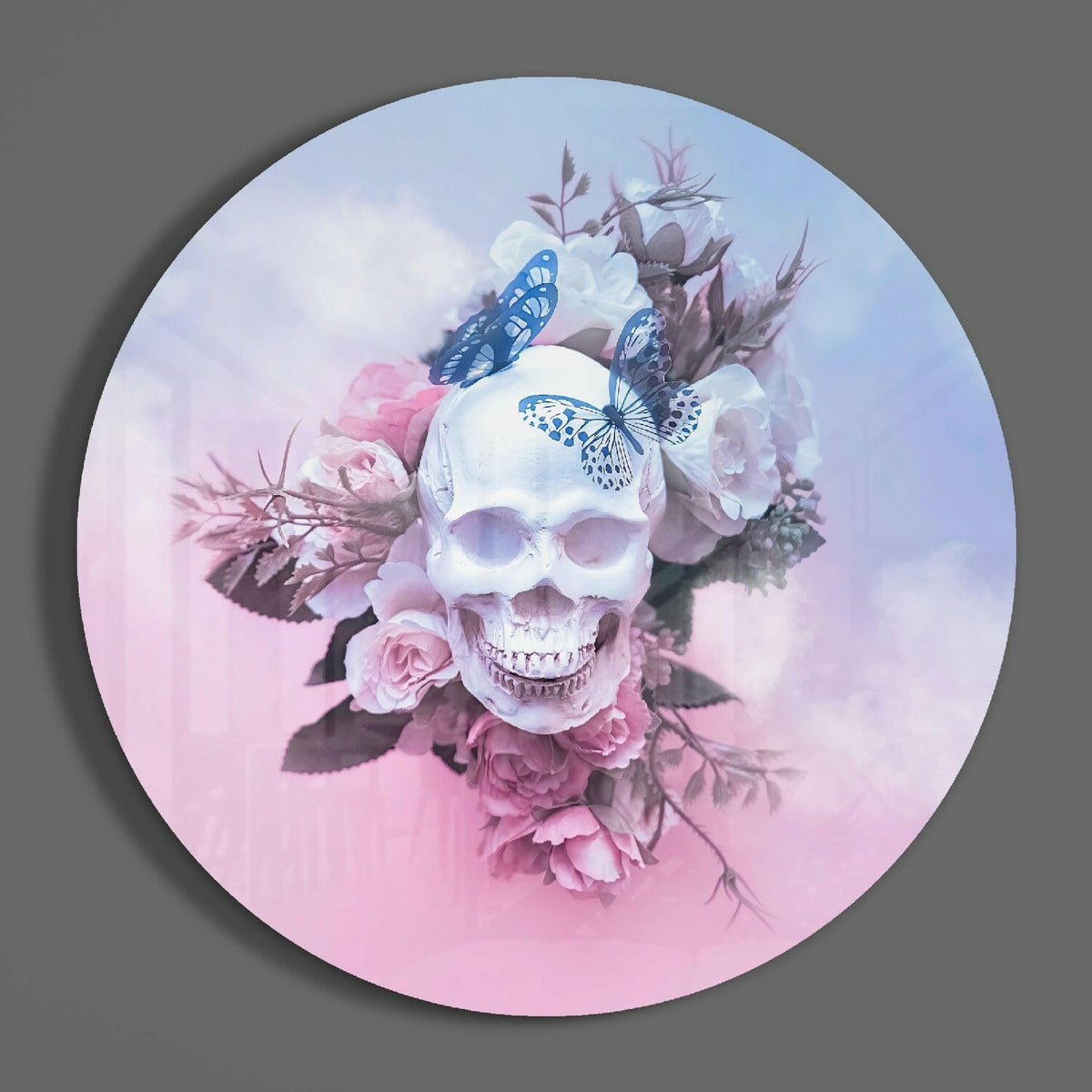 Pastel floral skull round glass wall art hanging on a plain gray wall