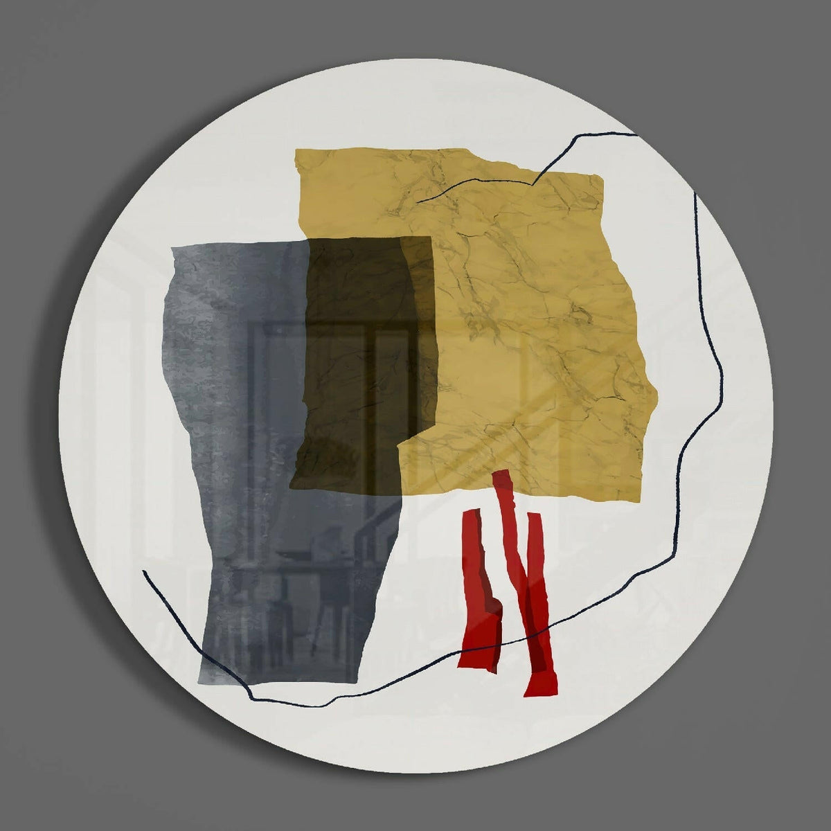 Gold and gray abstract collage round glass wall art on a plain gray wall