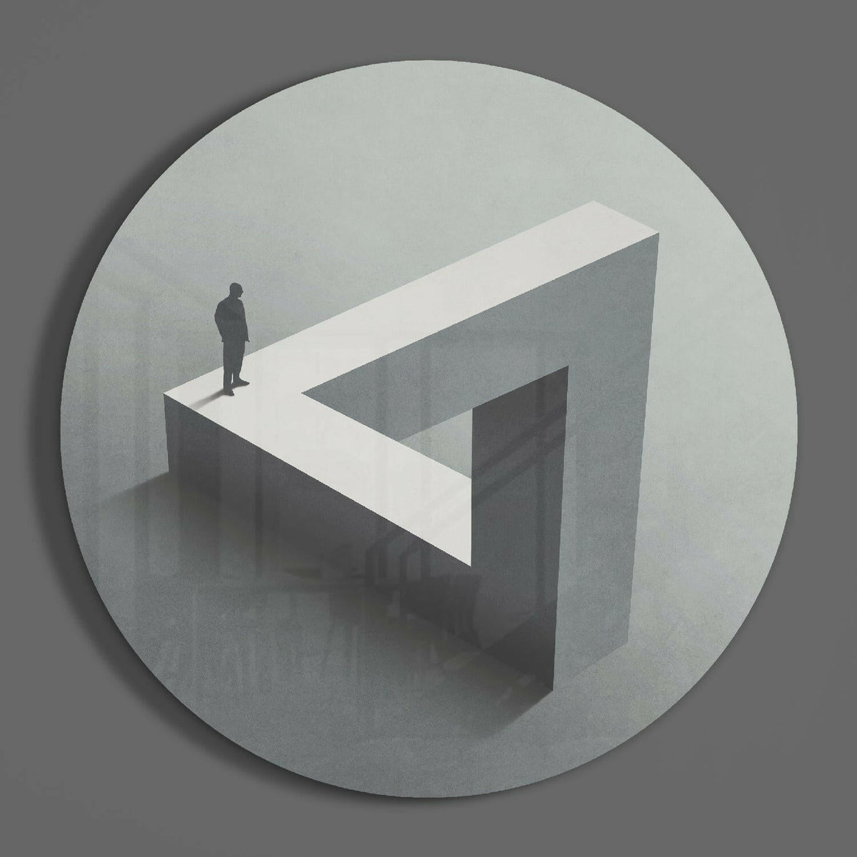 Impossible triangle round glass wall art on a plain gray wall, glossy glass disc seen from the front