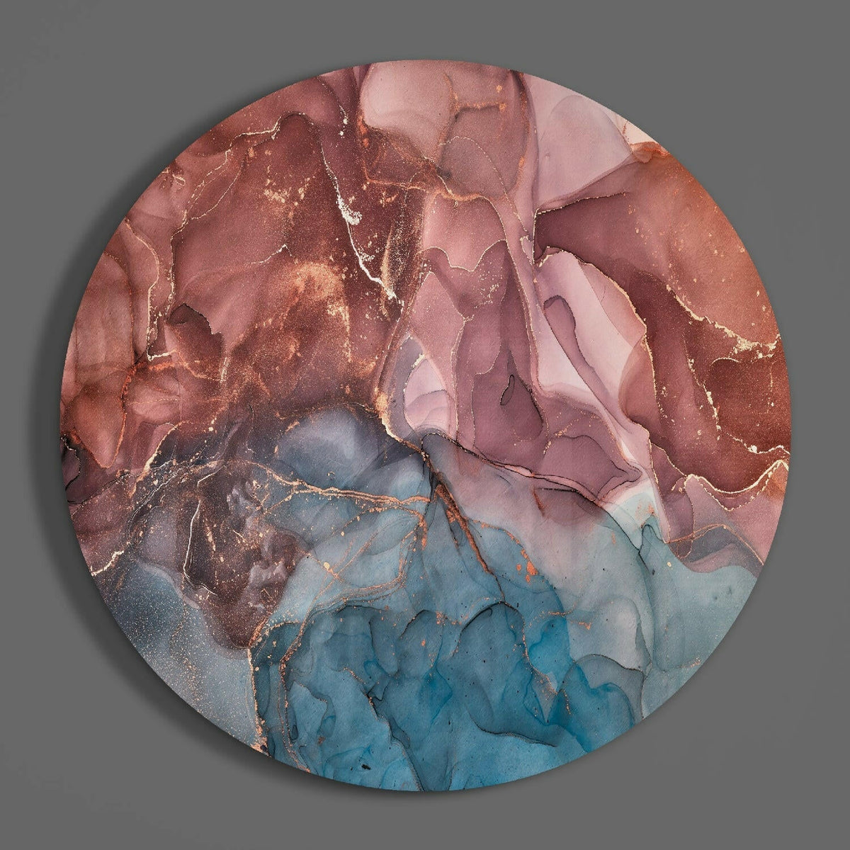Rose and blue marble round glass wall art hanging on a plain gray wall