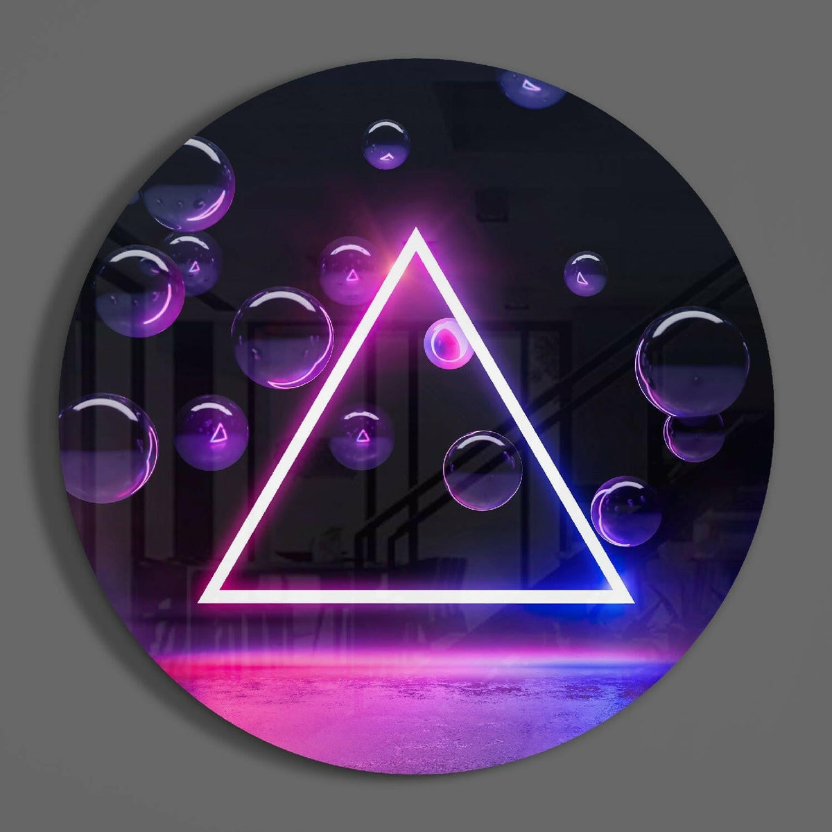 Neon triangle round glass wall art hanging on a plain gray wall