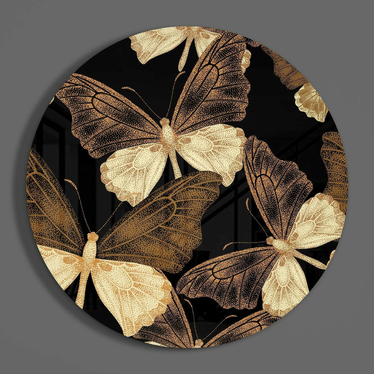 Black and gold butterfly round glass piece shown on a plain gray wall