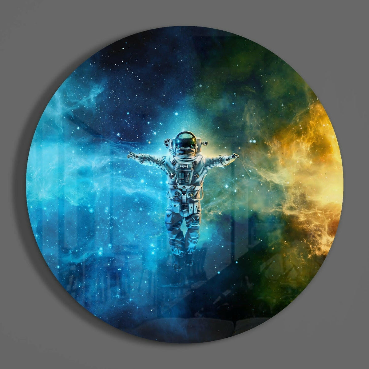 Teal and gold nebula astronaut round glass wall art on a plain gray wall