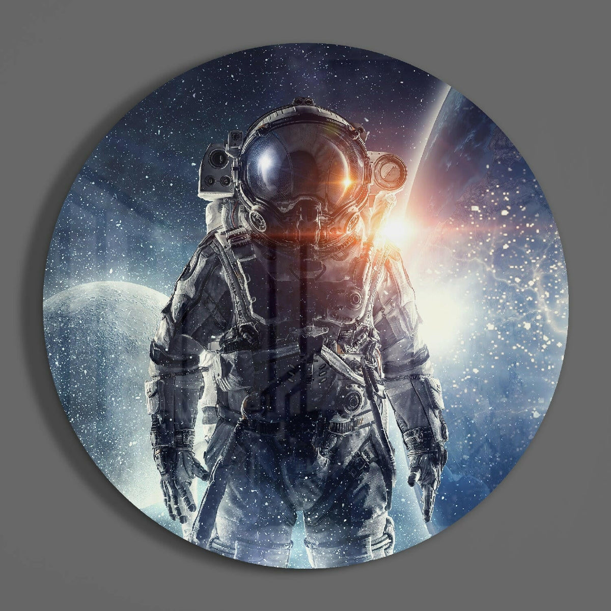 Astronaut in deep space round glass wall art on a plain gray wall, glossy glass disc seen from the front